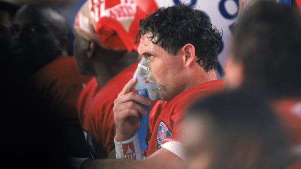 San Francisco quarterback Steve Young takes some oxygen on the sideline during Super Bowl XXIX, a 49-26 win over the San Diego Chargers.