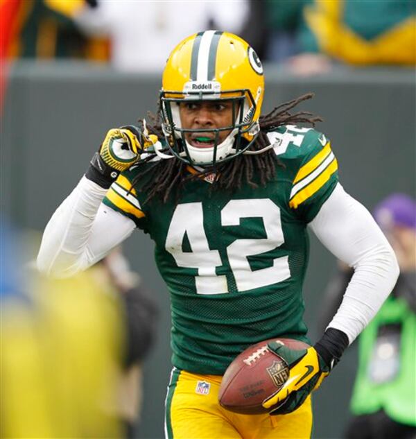 FILE PHOTO: Green Bay Packers' Morgan Burnett reacts after intercepting a pass during the second half of an NFL football game against the Minnesota Vikings Sunday, Dec. 2, 2012, in Green Bay, Wis. (AP Photo/Mike Roemer)