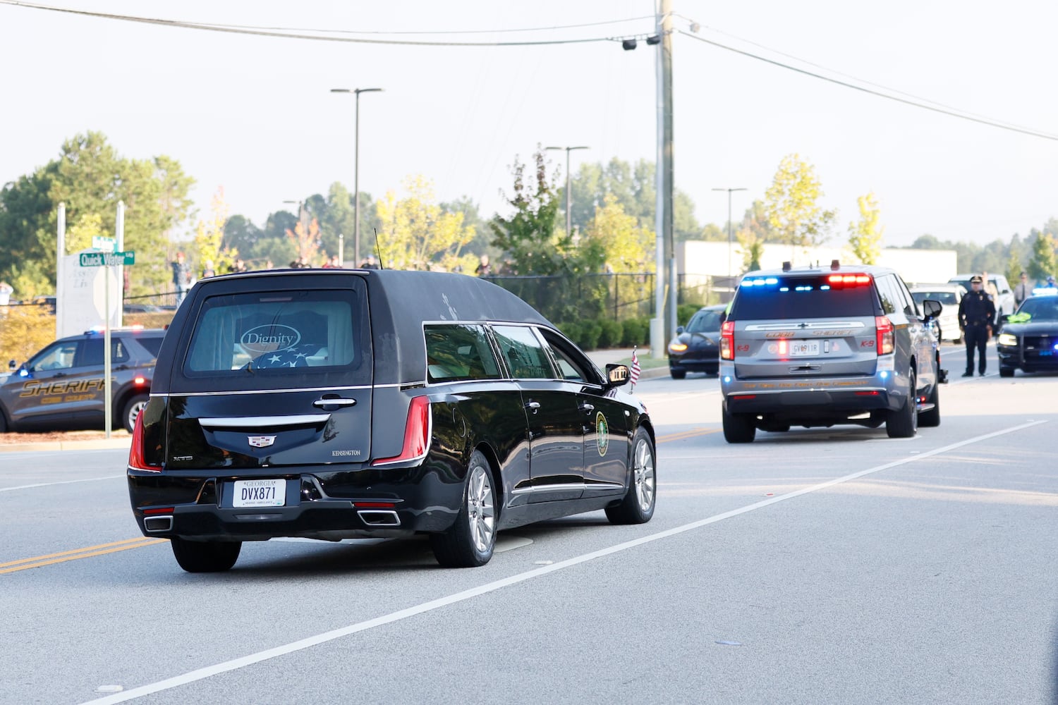 Cobb County Sheriff escorts the hearse of Deputy Jonathan Koleski's hearse as they arrive at the NorthStar Church for his funeral services on Wednesday, September 14, 2022. 