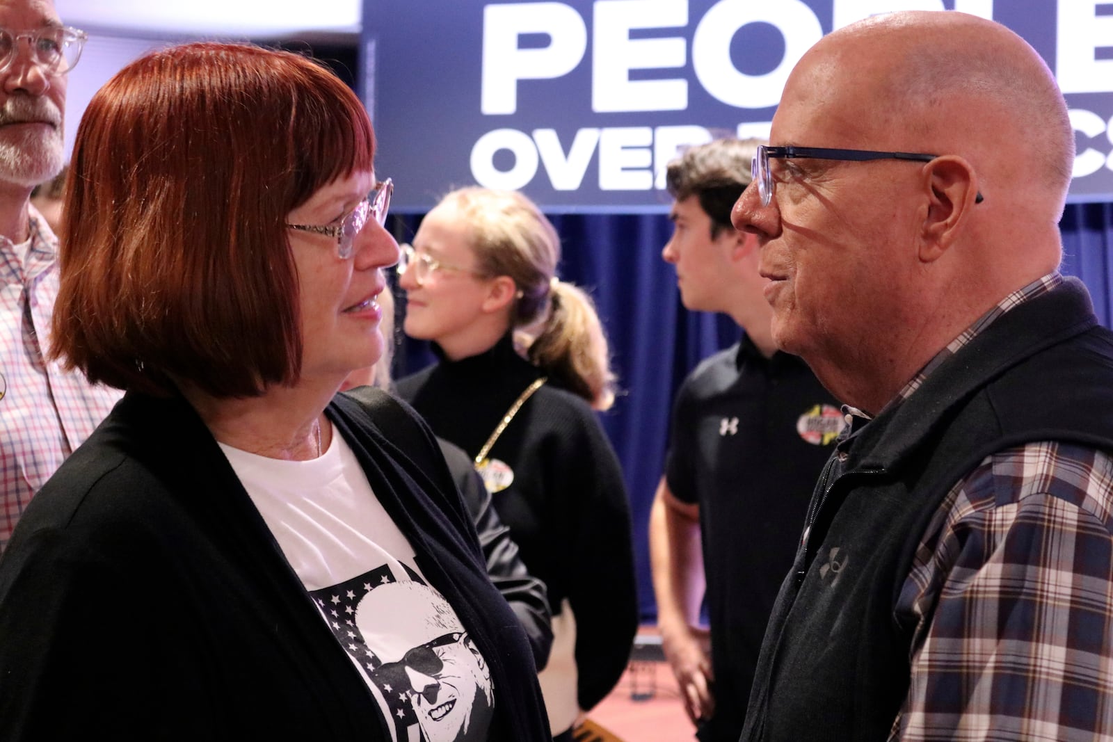 Republican former Gov. Larry Hogan, who is running for U.S. Senate in Maryland, talks to supporter Virginia Umberger during a campaign stop in Millersville, Md., Thursday, Oct. 24, 2024. (AP Photo/Brian Witte)