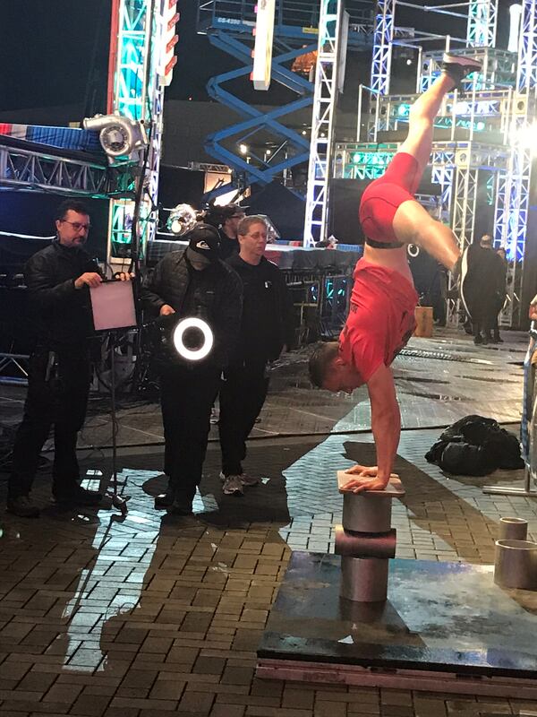 One of the contestants shows off his handstand technique before competing.