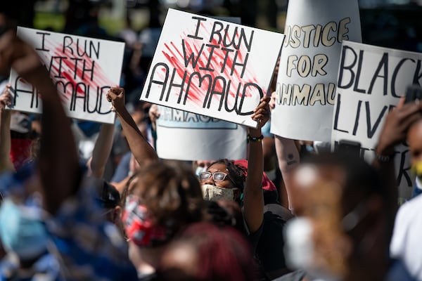 Demonstrators protest the shooting death of Ahmaud Arbery at the Glynn County Courthouse on May 8, 2020, in Brunswick, Georgia. Gregory McMichael and Travis McMichael were arrested the previous night and charged with murder. (Sean Rayford/Getty Images/TNS)