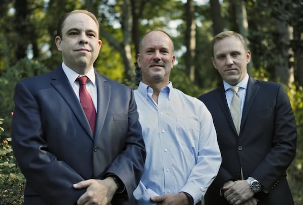 Gerald Lynn Bostock (center) with his attorneys, Tom Mew (left) and Brian Sutherland. The case of former Clayton County child welfare official Gerald Lynn Bostock is among three the Supreme Court is set to examine. The U.S. Supreme Court will consider a metro-Atlanta case as it weighs whether gay, lesbian and transgender workers are protected under federal anti-discrimination laws. In what could be a landmark ruling, the high court will decide whether Title VII of the Civil Rights Act of 1964 extends workplace protections to members of the LGBT community. Bob Andres / robert.andres@ajc.com