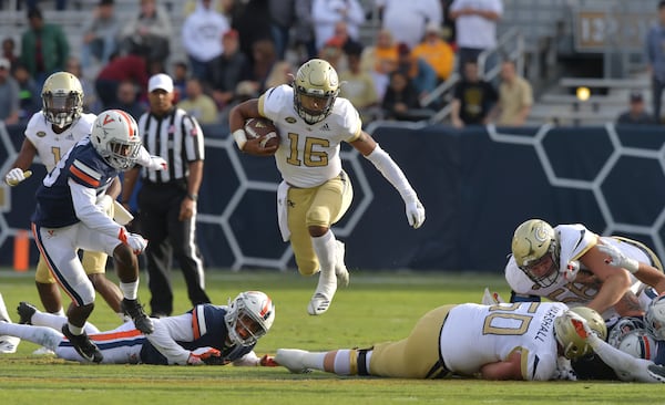 Georgia Tech quarterback TaQuon Marshall (16) leaps over for a first down in the first half at Bobby Dodd Stadium on Saturday, November 17, 2018. HYOSUB SHIN / HSHIN@AJC.COM