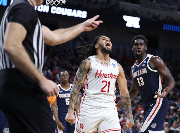 Houston guard Emanuel Sharp (21) reacts after a foul by Gonzaga forward Graham Ike (13) during the second half in the second round of the NCAA college basketball tournament, Saturday, March 22, 2025, in Wichita, Kan. (AP Photo/Travis Heying)