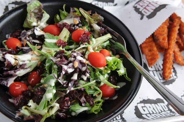 Grind house Salad with organic greens, cherry tomatoes, dried cranberries, sunflower seeds, lemon vinaigrette. (BECKY STEIN PHOTOGRAPHY)