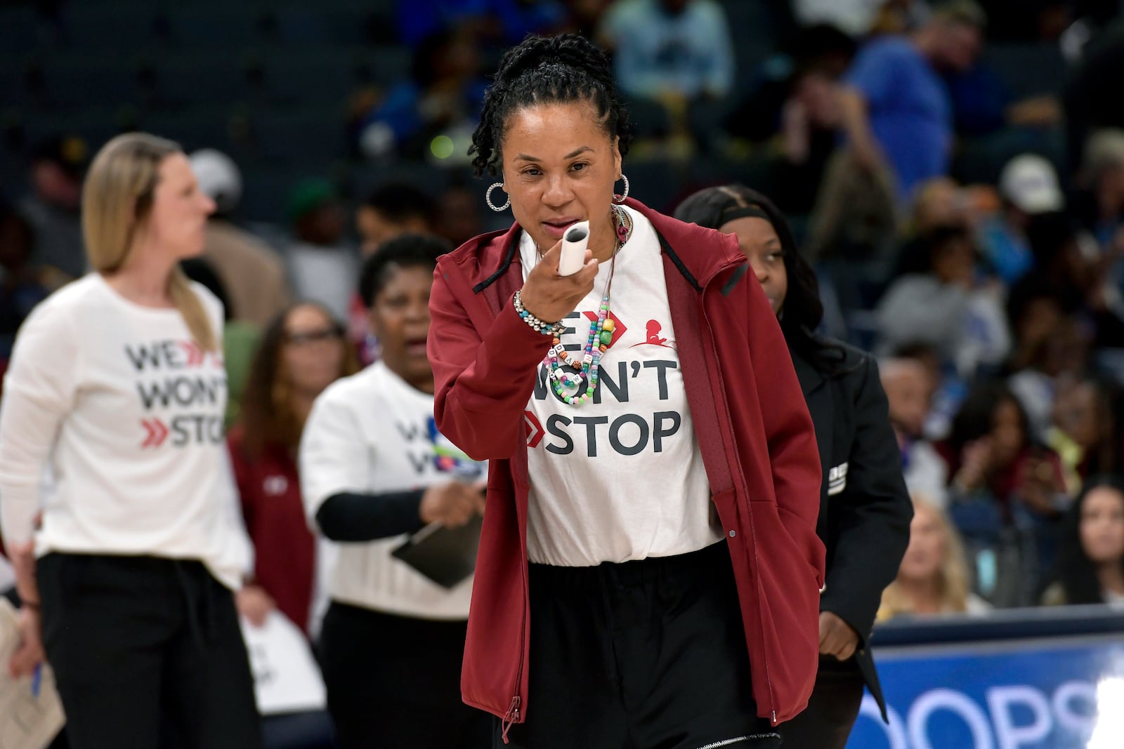 South Carolina head coach Dawn Staley stands on the court during the Hoops for St. Jude Tip Off Classic NCAA college basketball exhibition game against Memphis Tuesday, Oct. 15, 2024, in Memphis, Tenn. (AP Photo/Brandon Dill)