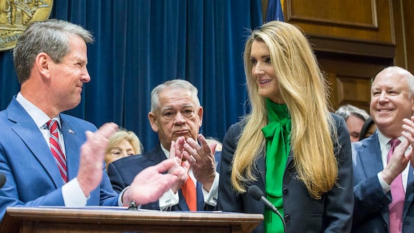 12/04/2019 -- Atlanta, Georgia -- Lawmakers applaud as newly appointed U.S. Senator Kelly Loeffler (second from right) is introduced by Georgia Gov. Bria Kemp (left) during a press conference in the Governor's office at the Georgia State Capitol Building, Wednesday, December 4, 2019. Georgia Gov. Brian Kemp appointed Kelly Loeffler to the U.S. Senate to take the place of U.S. Senator Johnny Isakson, who is stepping down for health reasons. (ALYSSA POINTER/ALYSSA.POINTER@AJC.COM)