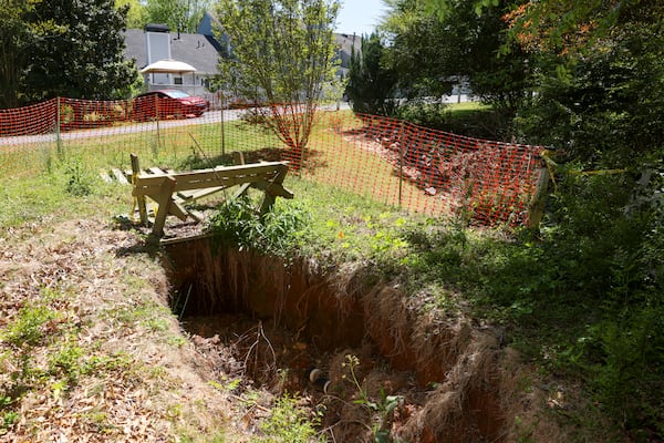 A sink hole is shown in the Common Area which has made the space unusable by residents at Willow Brook, Jason Getz / Jason.Getz@ajc.com)
