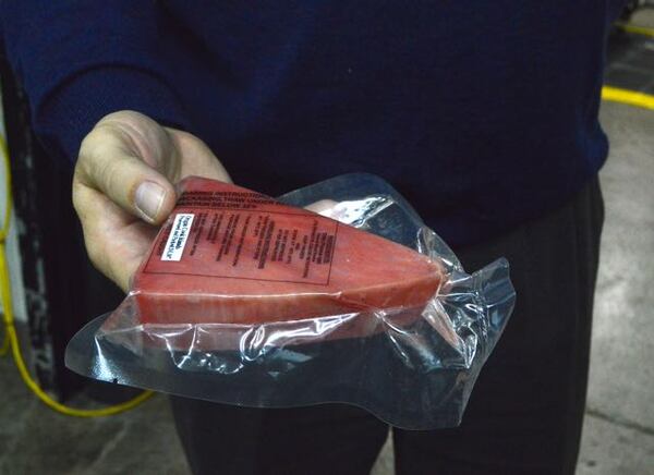 A frozen slab of wild-caught tuna.