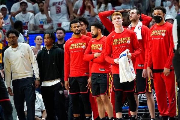 Atlanta Hawks guard Kevin Huerter, second from right, during the second half of Game 2 of an NBA basketball first-round playoff series, Tuesday, April 19, 2022, in Miami. The Heat won 115-105. (AP Photo/Lynne Sladky)