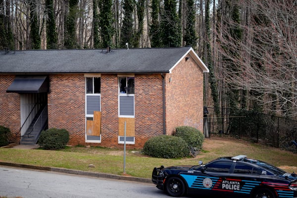 Windows remain broken after a Wednesday fire that killed three children at the Country Oaks Apartments. (Ben Hendren for The Atlanta Journal-Constitution)