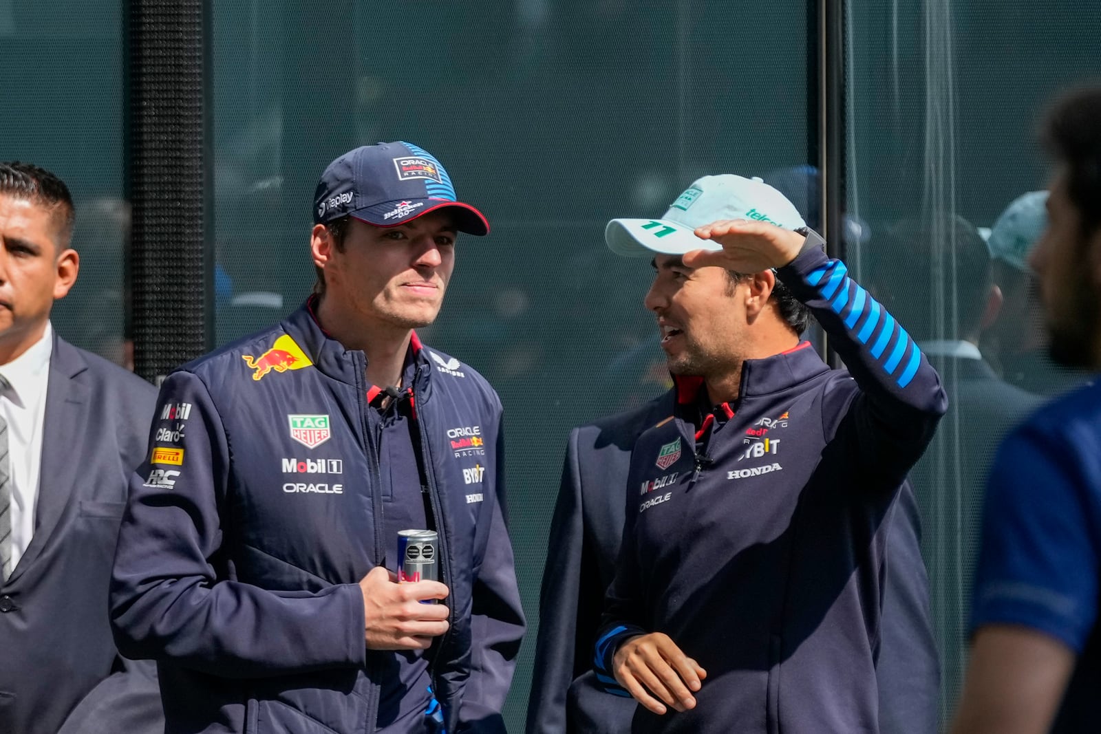 Red Bull drivers Max Verstappen, from the Netherlands, left, and Sergio Perez, from Mexico, attend a promotional event in Mexico City, Wednesday, Oct. 23, 2024, ahead of the weekend Formula One Mexico Grand Prix auto race. (AP Photo/Moises Castillo)