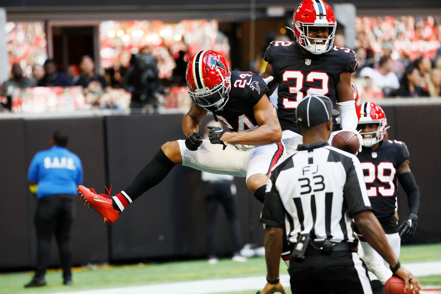 Falcons safety Jaylinn Hawkins (32) celebrates with cornerback A.J. Terrell after Hawkins scored during the first quarter Sunday in Atlanta against the 49ers. (Miguel Martinez / miguel.martinezjimenez@ajc.com)