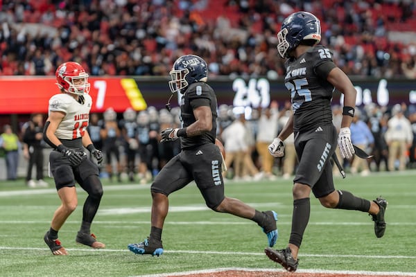 Cedar Grove’s Boden Walker (0) runs in for touchdown during the Class 3A GHSA State Championship game at Mercedes-Benz Stadium, on Wednesday, Dec. 13, 2023, in Atlanta. (Jason Allen for the Atlanta Journal Constitution)