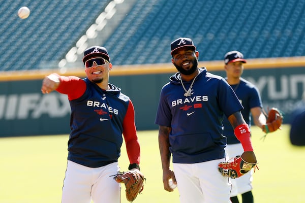 Marcell Ozuna (right) and former Brave William Contreras have fun during a workout prior to the start of the 2022 National League Division Series.