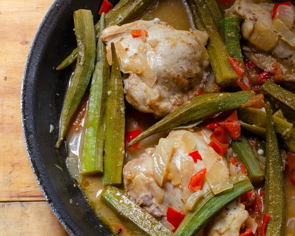 Chicken and okra are simmered with tomatoes and red bell pepper in this Brazilian fricassee. (Virginia Willis for The Atlanta Journal-Constitution)