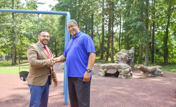 Stonecrest Mayor Jason Lary and parks director Sean DePalma at the Browns Mill Recreation Center. The city announced plans to replace the playground equipment.