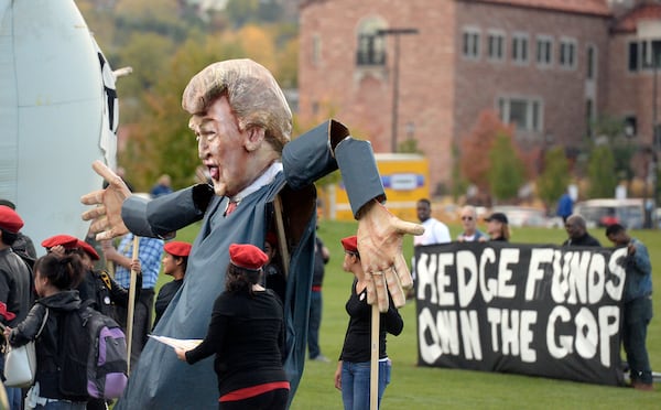 A giant Donald Trump puppet is displayed in the "Free Speech Zone" outside the venue of the GOP presidential debate on Wednesday, Oct. 28, 2015, at the Coors Event Center on the University of Colorado campus in Boulder, Colo. (Jeremy Papasso/Daily Camera via AP) NO SALES; MANDATORY CREDIT