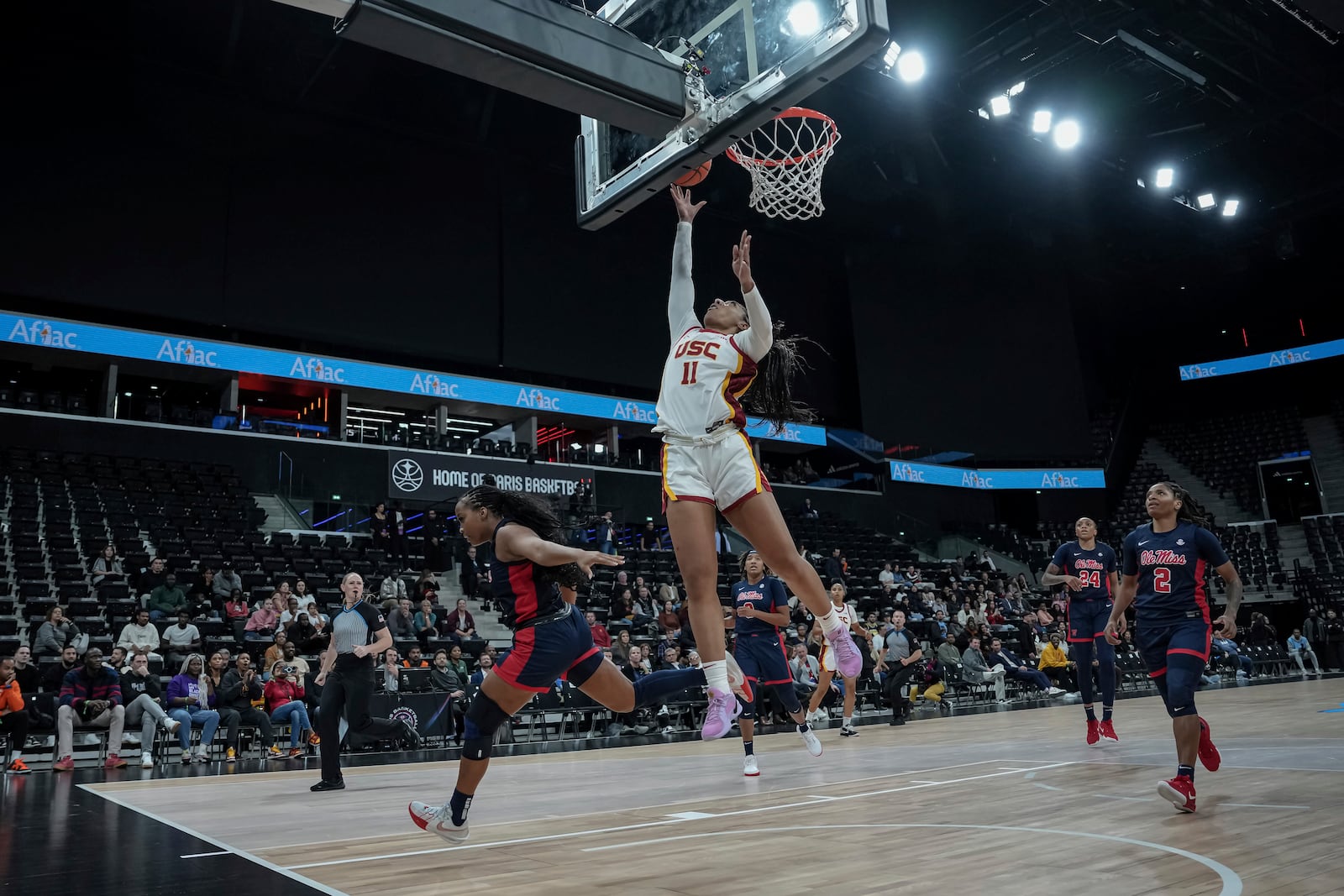 USC Trojans's guard Kennedy Smith scores during the basketball match between the University of Southern California (USC) and Ole Miss, Monday, Nov. 4, 2024 in Paris, France. (AP Photo/Aurelien Morissard)