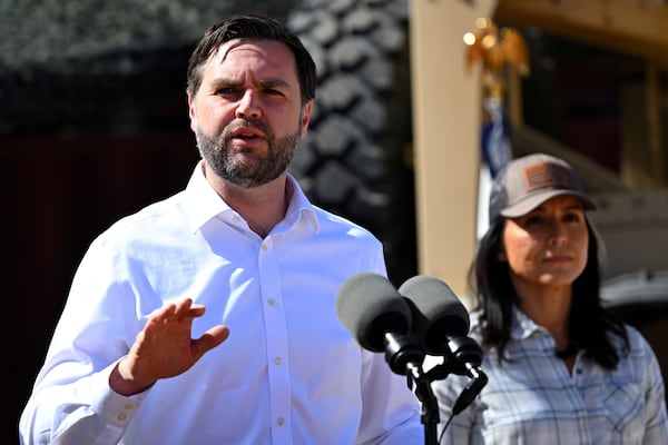 Vice President JD Vance speaks to reporters during a visit to the U.S. border with Mexico Wednesday, March 5, 2025, in Eagle Pass, Texas, as Director of National Intelligence Tulsi Gabbard listens. (Brandon Bell/Pool via AP)