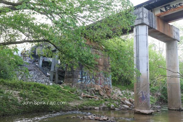 Damage remains after a  fire under a railroad bridge near Cheshire Bridge Road in Buckhead. JOHN SPINK / JSPINK@AJC.COM