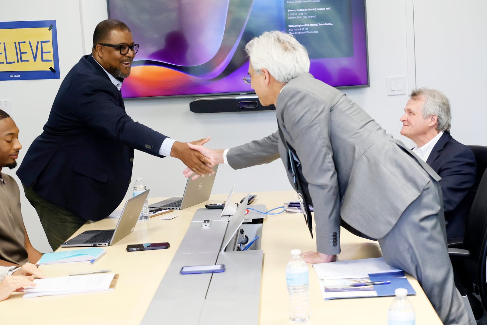 Leroy Chapman Jr. The Atlanta Journal-Constitution's recently appointed editor-in-chief, shakes hands with Dr. Ravi Thadhani, recently appointed executive vice president for health affairs at Emory University, during an editorial board meeting at the AJC’s headquarters on Monday, August 14, 2023.
(PHOTO by Miguel Martinez / miguel.martinezjimenez@ajc.com)