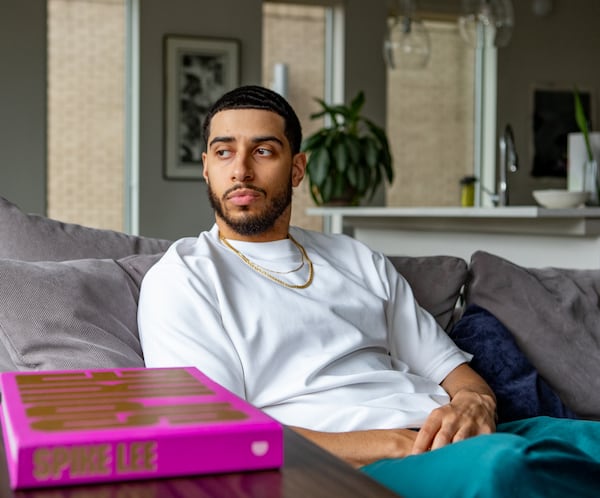 Rapper Will Hill, shown here in his Buckhead home, is an emerging artist and one to watch in 2025.  (Jenni Girtman for The Atlanta Journal-Constitution)