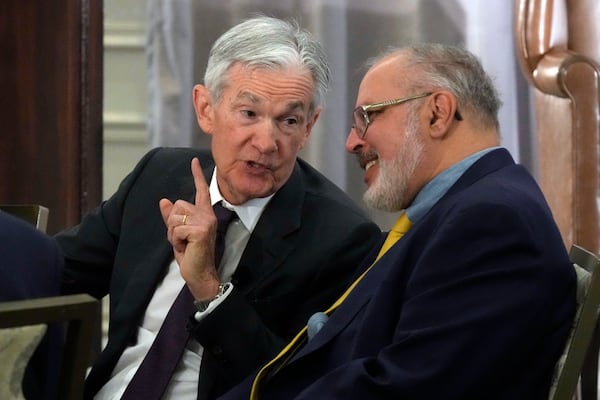 Federal Reserve Chair Jerome Powell, left, talks with Anil Kashyap, Professor of Economics and Finance at the University of Chicago's Booth School of Business,, before his address to the annual U.S. Monetary Policy Forum, in New York, Friday, March 7, 2025. (AP Photo/Richard Drew),