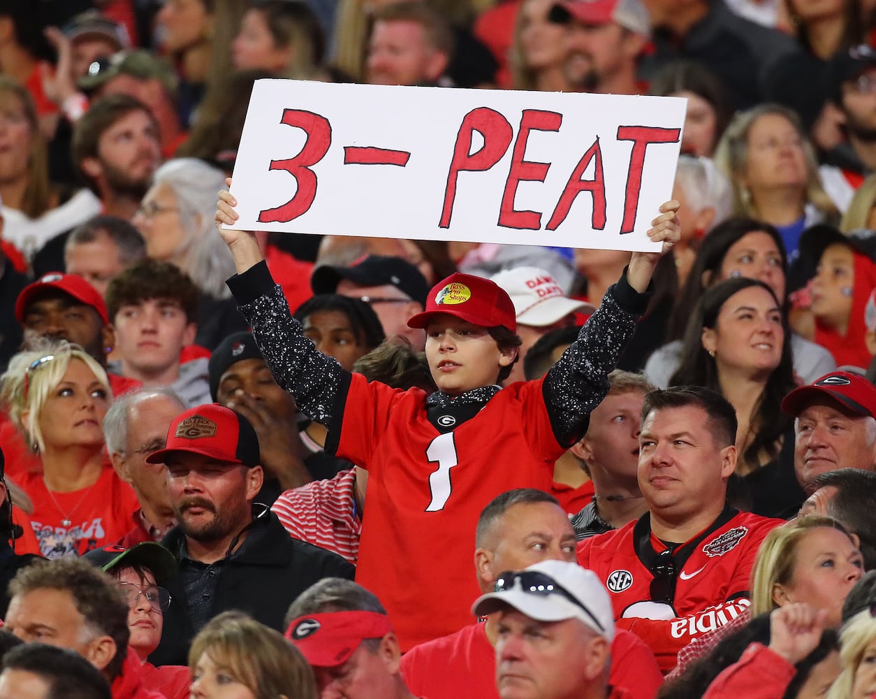 A Georgia fan is looking for a national championship 3-peat as his team takes a 21-0 lead over Kentucky during the first half in a NCAA college football game on Saturday, Oct. 7, 2023, in Athens.  Curtis Compton for the Atlanta Journal Constitution