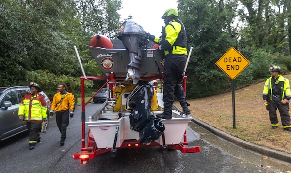 Atlanta Fire Rescue’s Dive/Swift Water Team performed welfare checks on residents on Hanover West Drive in Atlanta. All wanted to shelter in place. Helene, which entered Georgia as a Category 2 hurricane Friday morning, Sept. 27, 2024 downgraded to a tropical storm but brought a lot of problems to Atlanta with numerous water rescues and incessant rain. More than 1.1 million power outages have been reported statewide, and flash flooding remained a major concern. (John Spink/AJC)