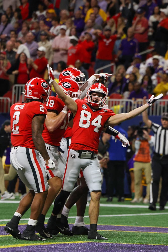 Georgia Bulldogs wide receiver Ladd McConkey (84) celebrates a touchdown against the LSU Tigers during the second half of the SEC Championship Game at Mercedes-Benz Stadium in Atlanta on Saturday, Dec. 3, 2022. (Jason Getz / Jason.Getz@ajc.com)