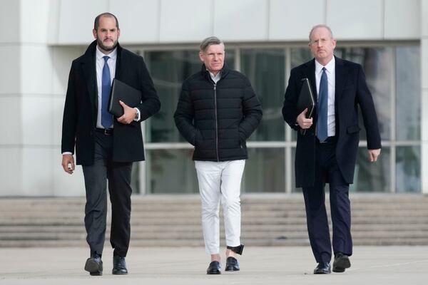 Matthew Smith, center, leaves a federal courthouse in Central Islip, N.Y., Tuesday, Dec. 3, 2024. (AP Photo/Seth Wenig)