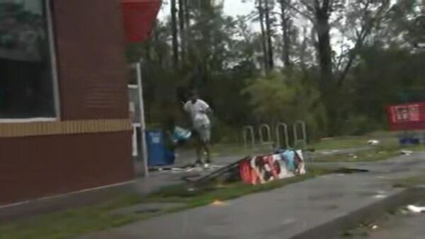 People were seen looting a Family Dollar in the wake of Tropical Storm Florence. (Photo: WSOCTV.com)