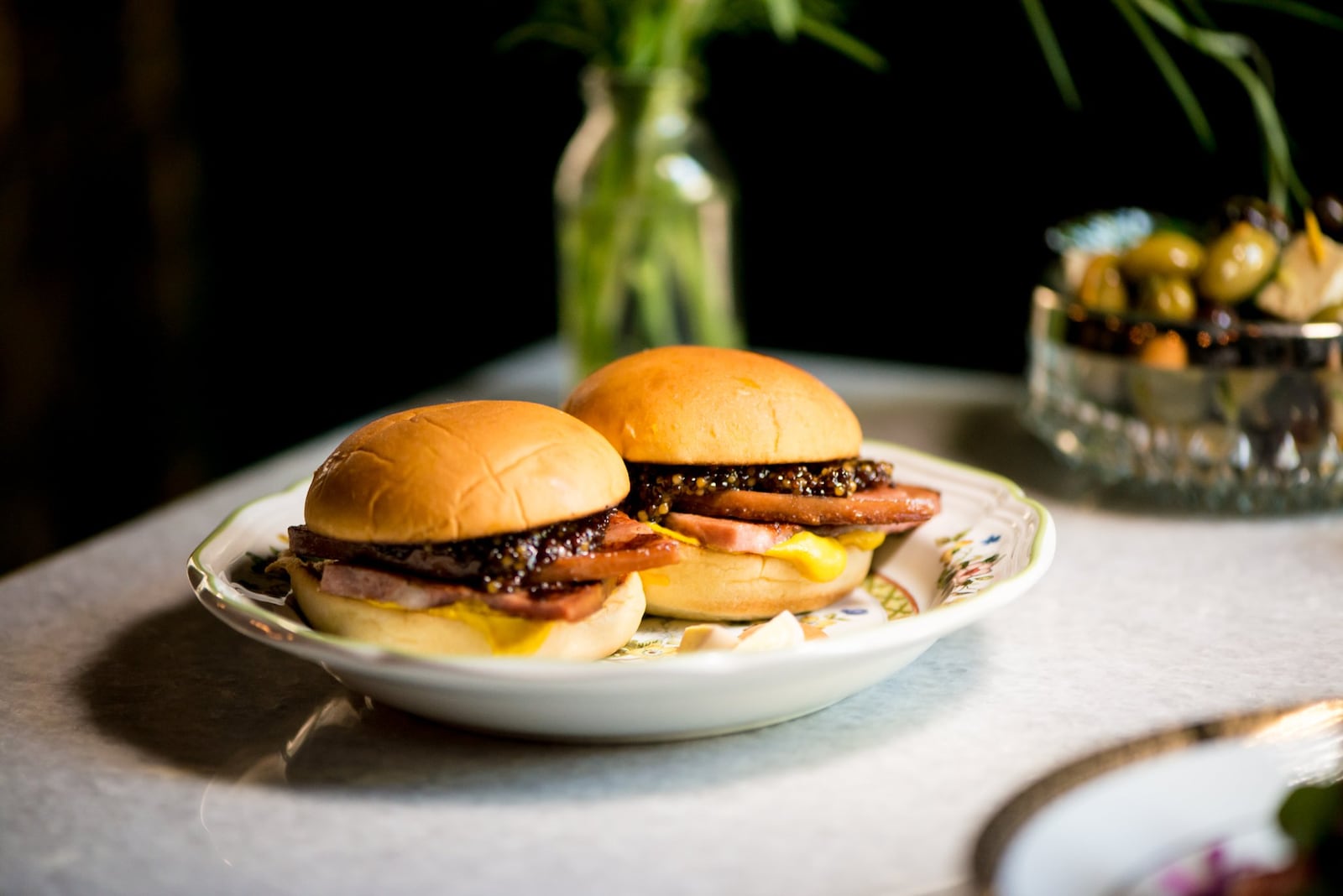 Mortadella snack sandwiches on potato rolls with mustard. Photo credit- Mia Yakel.