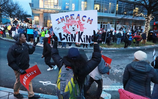 December 17, 2019 Atlanta: Hundreds of impeachment activists gather outside the Office of Senator David Perdue at the Terminus business and residential complex as part of the nationwide âNobody Is Above the Lawâ rallies on Tuesday, December 17, 2019, in Atlanta.  Curtis Compton/ccompton@ajc.com