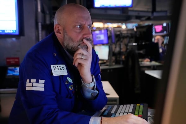 Specialist Meric Greenbaum works on the floor of the New York Stock Exchange, Tuesday, March 11, 2025. (AP Photo/Richard Drew)