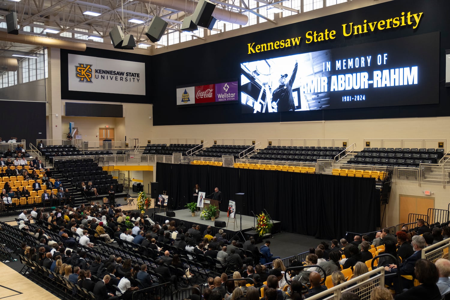 Michael Kelly, vice president for athletics at the University of South Florida, delivers remarks during a celebration of life for former KSU basketball coach Amir Abdur-Rahim at the KSU convocation center on Sunday, Oct. 27, 2024.   Ben Gray for the Atlanta Journal-Constitution