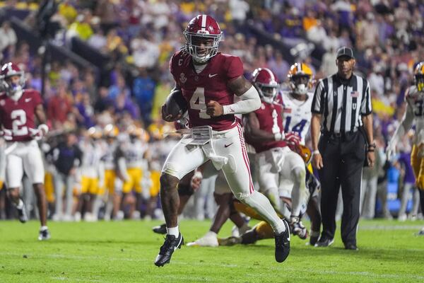 Alabama quarterback Jalen Milroe (4)crosses the goal line on a touchdown carry in the second half an NCAA college football game against LSU in Baton Rouge, La., Saturday, Nov. 9, 2024. (AP Photo/Gerald Herbert)