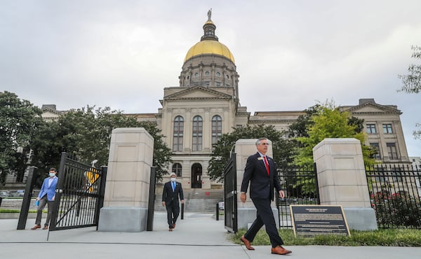 Georgia Secretary of State Brad Raffensperger, right, announced Tuesday that 1,000 Georgians voted twice in the state's June 9 primary, a felony that he said will be prosecuted to the fullest extent of the law. (John Spink / John.Spink@ajc.com)

