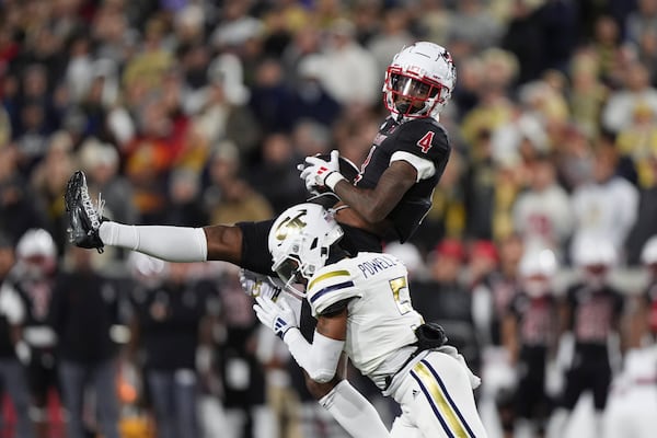 Georgia Tech defensive back Clayton Powell-Lee (5) tackles Georgia Tech wide receiver Abdul Janneh Jr. (4) during the first half of an NCAA college football game, Thursday, Nov. 21, 2024, in Atlanta. (AP Photo/Brynn Anderson)