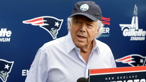 FILE - In this June 7, 2018, file photo, New England Patriots owner Robert Kraft speaks with reporters following an NFL football minicamp practice, in Foxborough, Mass. Police in Florida have charged New England Patriots owner Robert Kraft with misdemeanor solicitation of prostitution, saying they have videotape of him paying for a sex act inside an illicit massage parlor.  (AP Photo/Steven Senne, File)