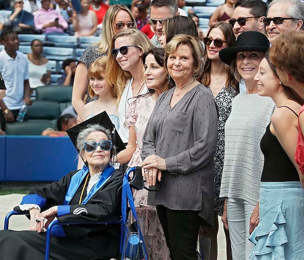 Joyce Lowenstein, 93, gathers with family members for a group photo after she received her bachelor's degree Thursday from Georgia State University.  She started taking classes there in 2012,  Her degree is in art history.    