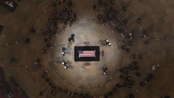 The flag-draped casket of the late former President George H.W. Bush as he lies in state in the Capitol Rotunda on December 5, 2018 in Washington, DC. A WWII combat veteran, Bush served as a member of Congress from Texas, ambassador to the United Nations, director of the CIA, vice president and 41st president of the United States. Bush will lie in state in the U.S. Capitol Rotunda until Wednesday morning.