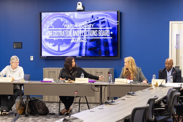 Fulton County election board members discuss certification during a meeting Tuesday in Union City. (Arvin Temkar / AJC)