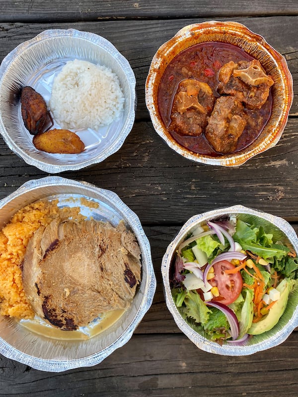 Two good options from D’Floridian are the spicy oxtails (with rice and plantains) and roasted pork loin (with rice and salad). Wendell Brock for The Atlanta Journal-Constitution