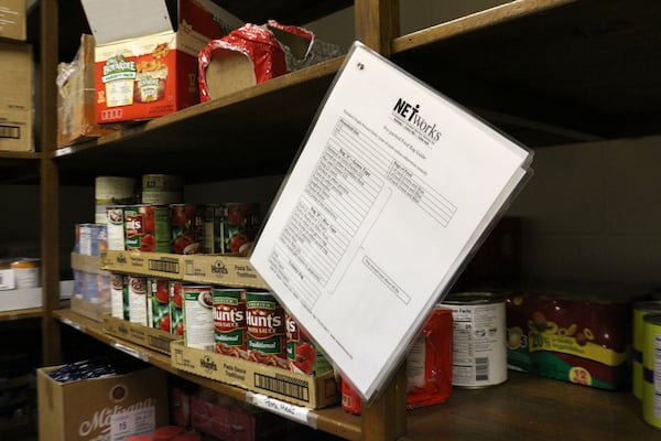 NETWorks Cooperative Ministry in downtown Tucker, provided emergency food assistance to local families three days per week throughout the pandemic. To prevent the spread of COVID-19, people checked in at a tent outside while volunteers filled a shopping cart with bags of non-perishable items and produce, when available. (William Newlin/UGA)