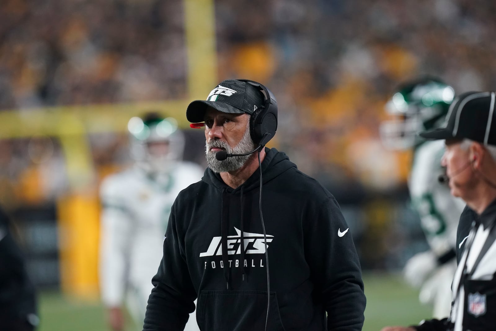 New York Jets head coach Jeff Ulbrich watches fro the sideline in the second half of an NFL football game against the Pittsburgh Steelers in Pittsburgh, Sunday, Oct. 20, 2024. (AP Photo/Matt Freed)