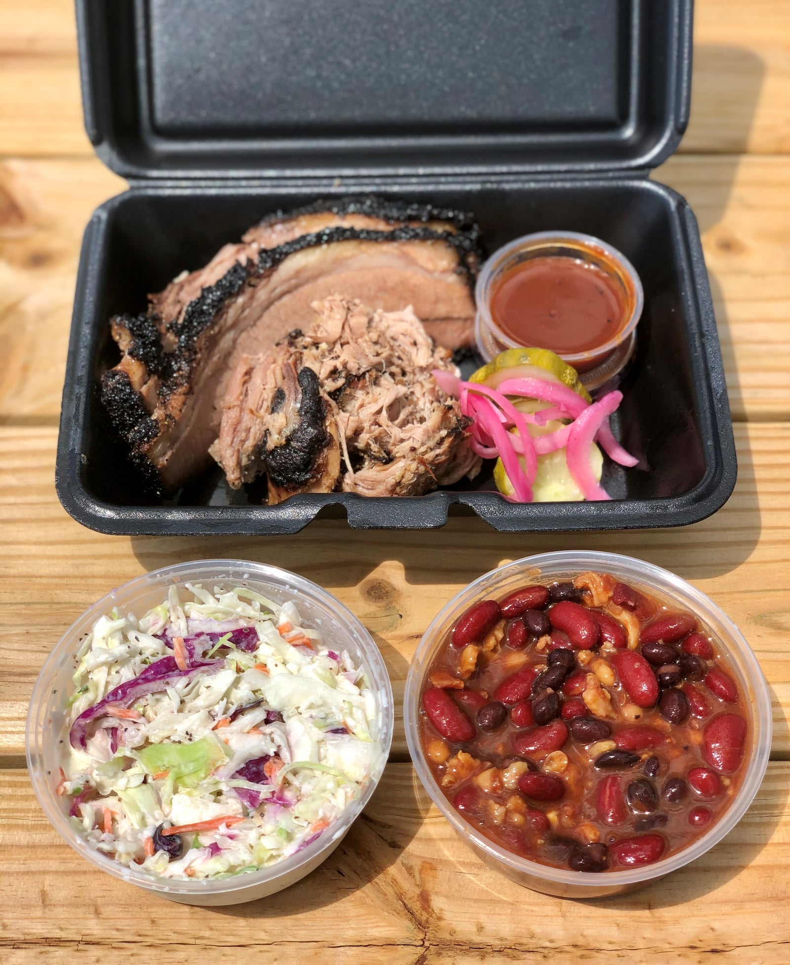 At Socks’ Love Barbecue: A two-meat plate with brisket, pulled pork, slaw and cowboy beans. 
Courtesy of Wendell Brock