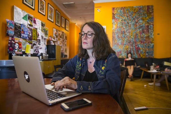 Author Laurel Snyder works at Joe’s East Atlanta Coffee Shop near her home in Ormewood Park. Alyssa Pointer/alyssa.pointer@ajc.com